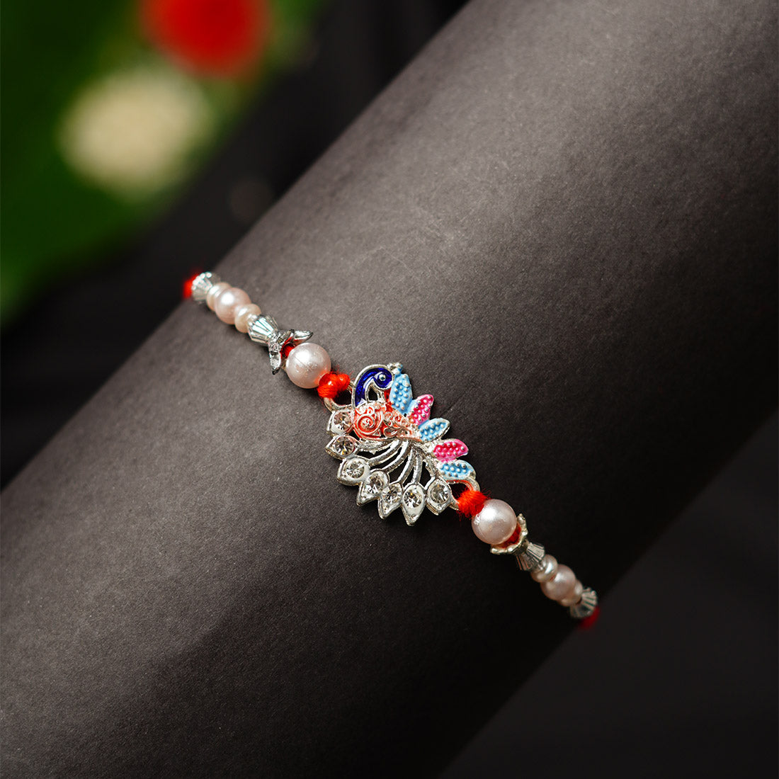 Silver Peacock Motif Beaded Rakhi