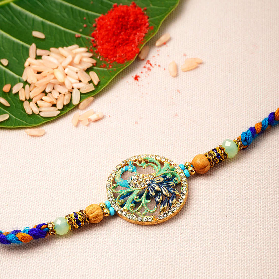 Blue Hued Peacock Mandala Rakhi