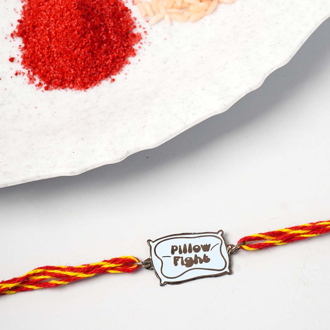 Pillow Fight Enamel Rakhi