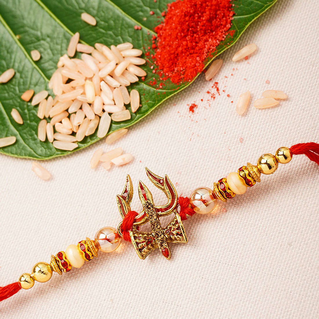 Red Beaded Trishool Damroo Rakhi